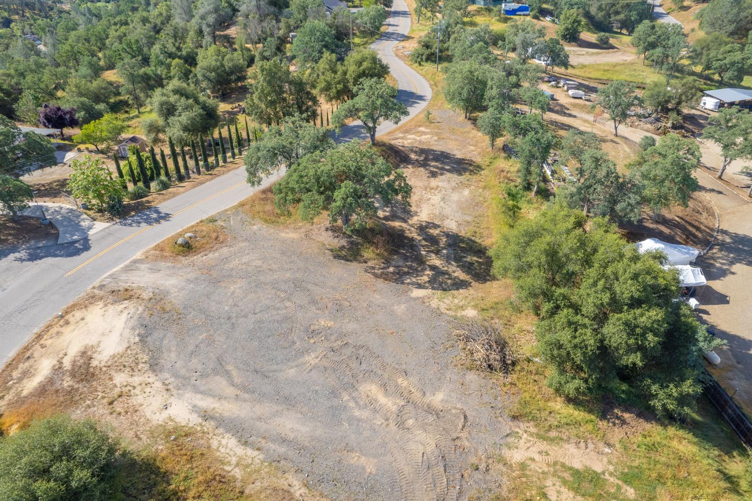 33717 River Knolls Road Coarsegold, CA 93614 - Photo 53 of 66 a view of a yard with plants and wooden fence