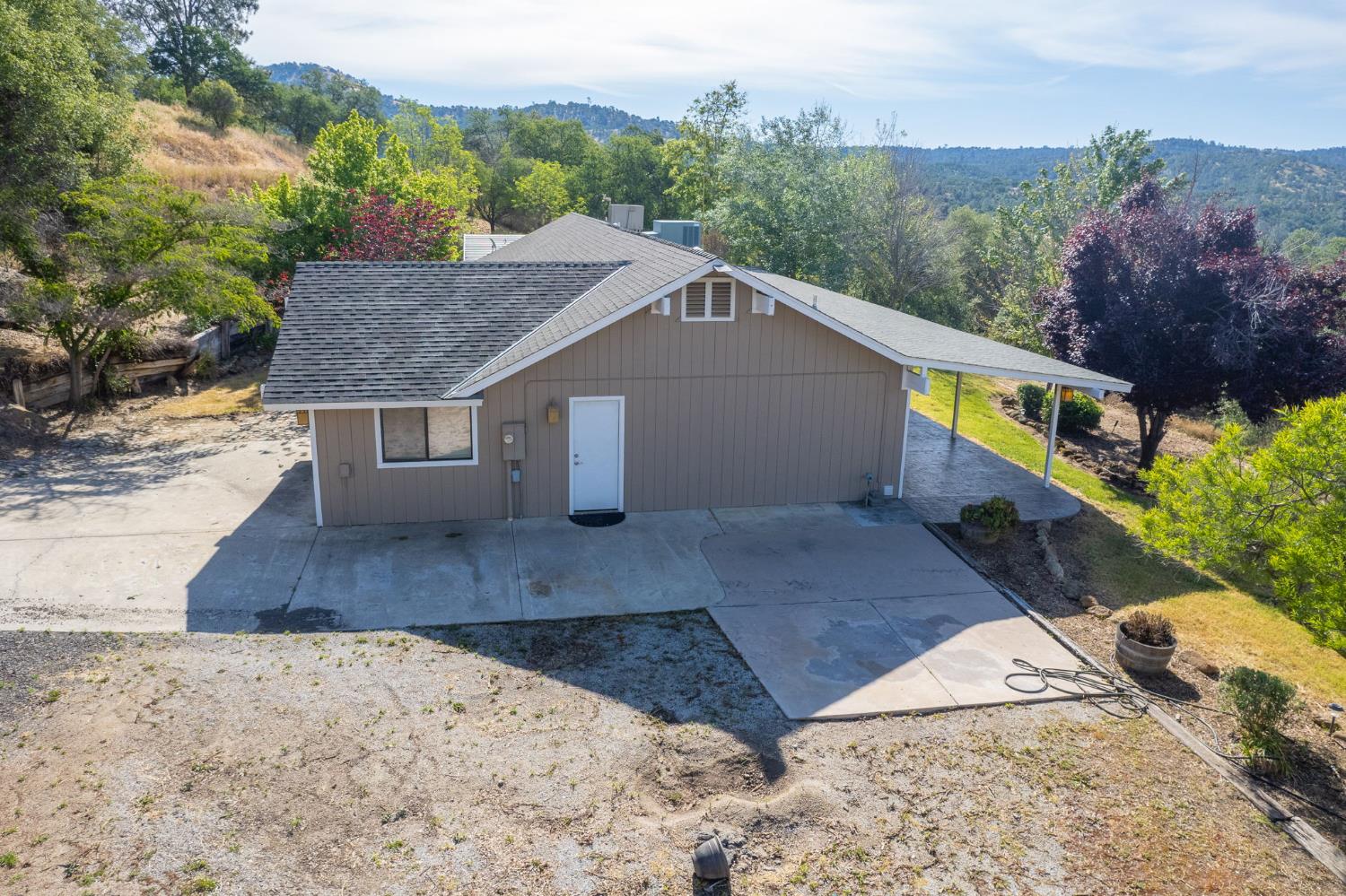 33717 River Knolls Road Coarsegold, CA 93614 - Photo 56 of 66 a view of a house with a yard and large tree