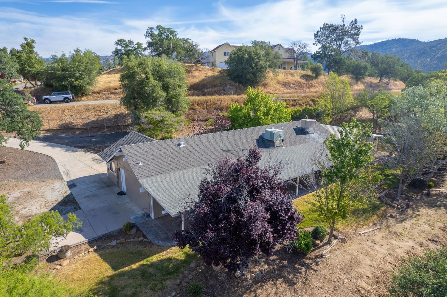 33717 River Knolls Road Coarsegold, CA 93614 - Photo 59 of 66 an aerial view of a house with a garden