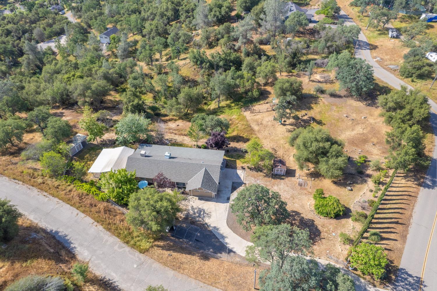 33717 River Knolls Road Coarsegold, CA 93614 - Photo 61 of 66 an aerial view of a house with a yard