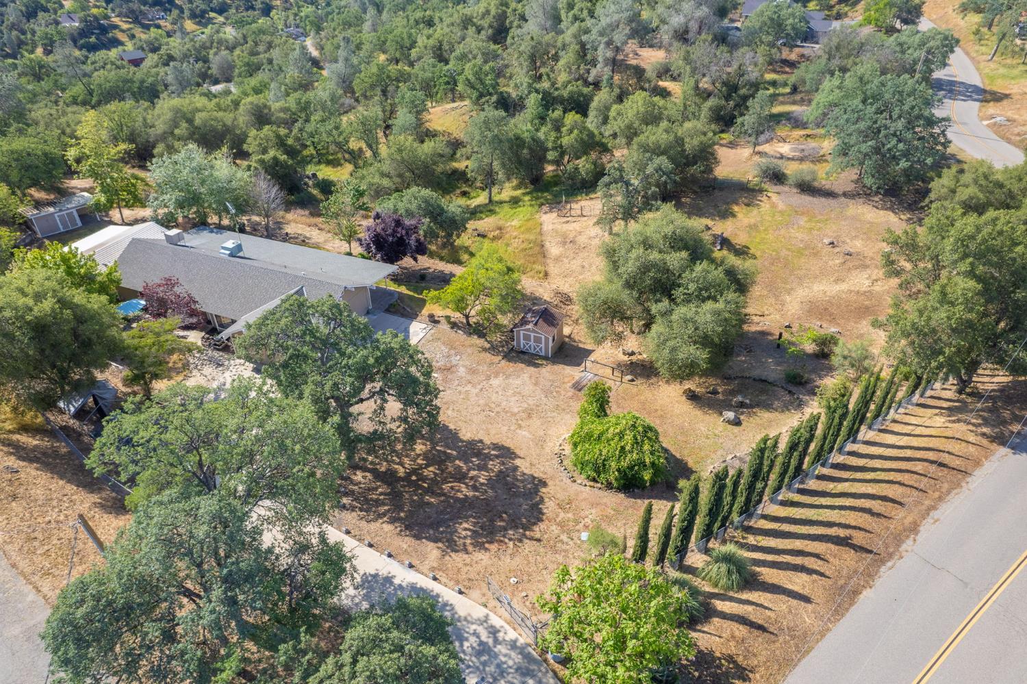 33717 River Knolls Road Coarsegold, CA 93614 - Photo 64 of 66 an aerial view of a house with a yard