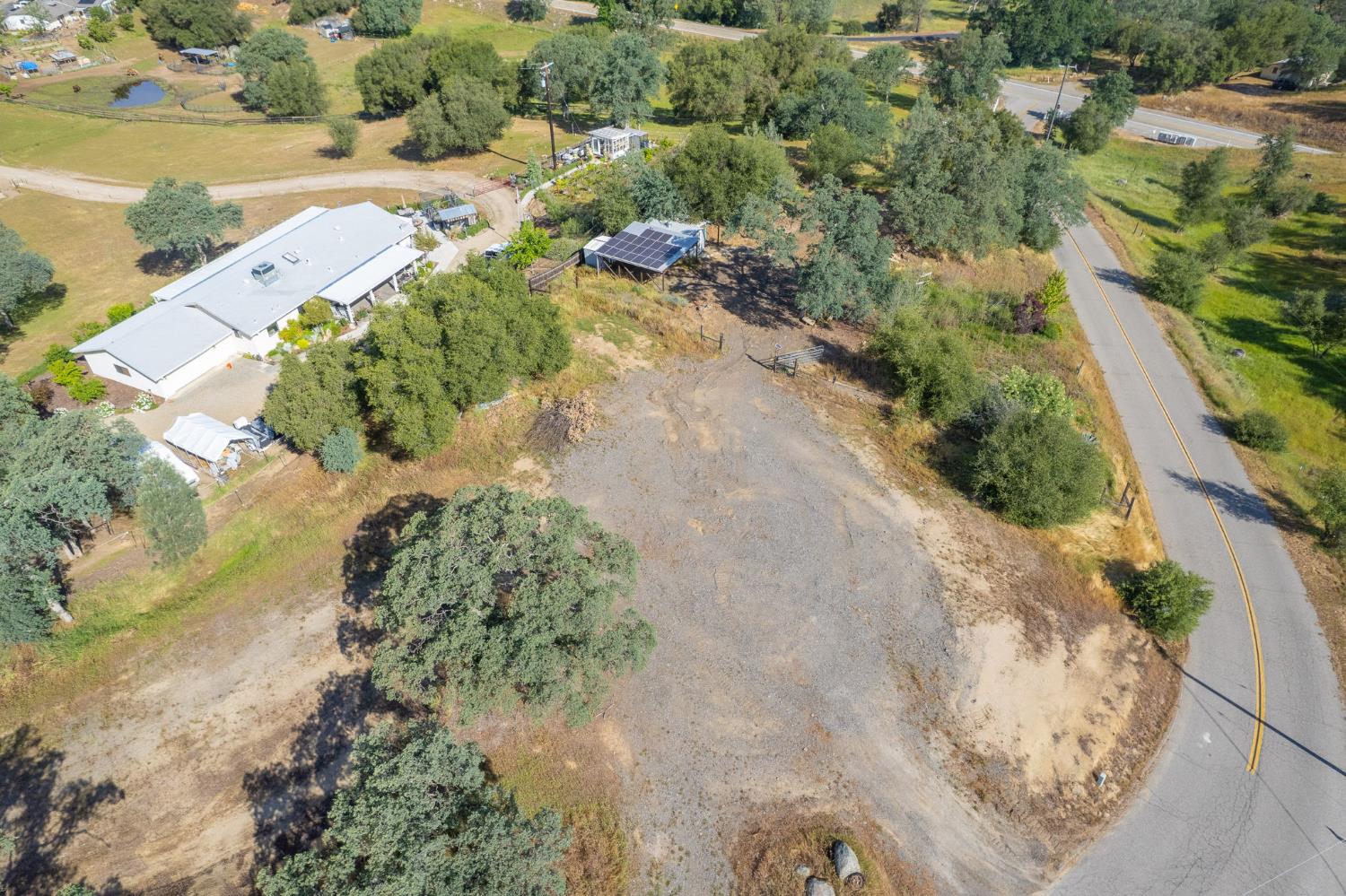 33717 River Knolls Road Coarsegold, CA 93614 - Photo 66 of 66 an aerial view of a houses with outdoor space
