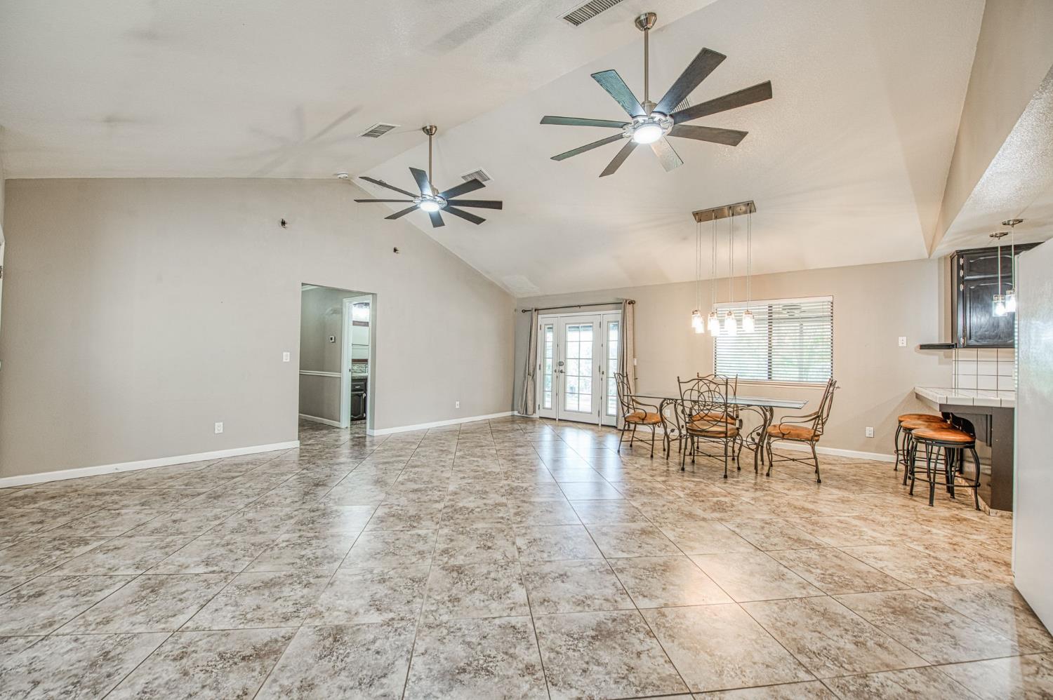 33717 River Knolls Road Coarsegold, CA 93614 - Photo 7 of 66 a view of a livingroom with furniture and a ceiling fan
