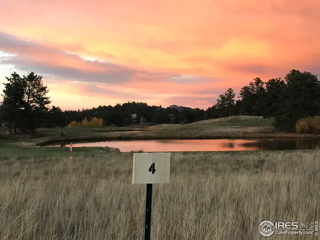 a view of lake with green space