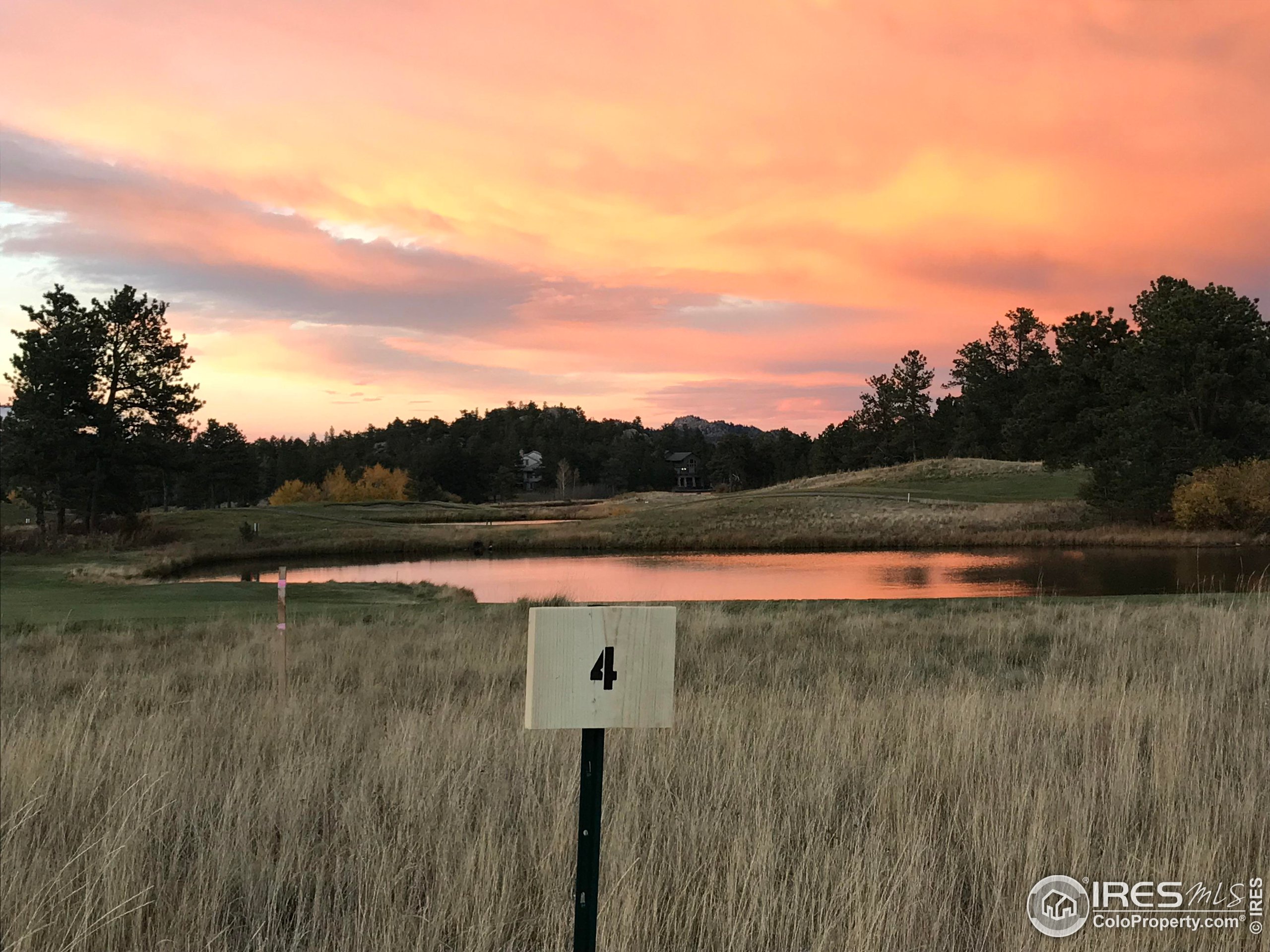a view of lake with green space
