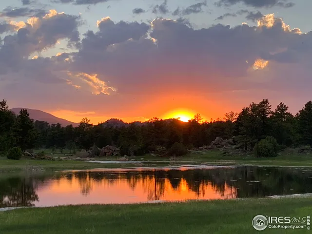 a view of a lake with a big yard