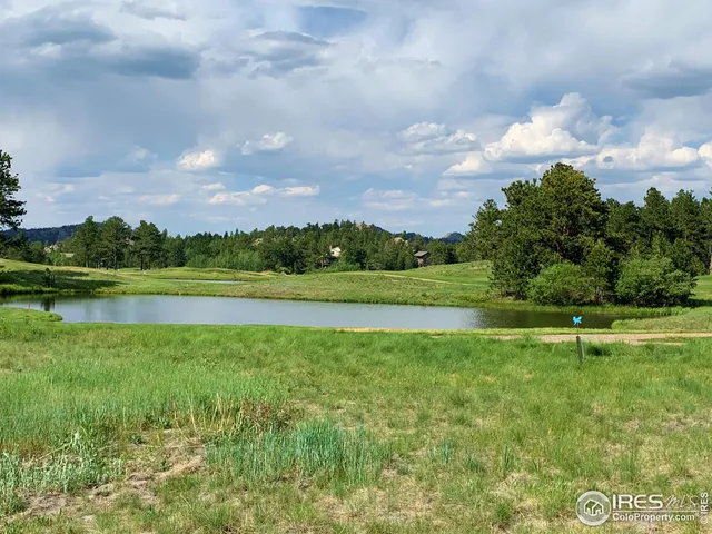 a view of a golf course with a lake