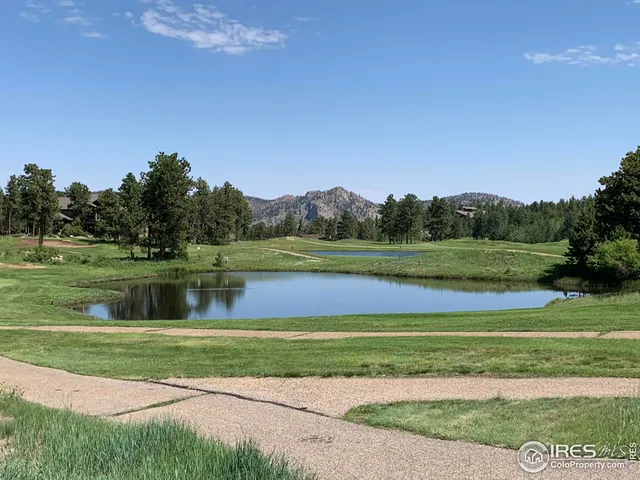 a view of a golf course with a lake
