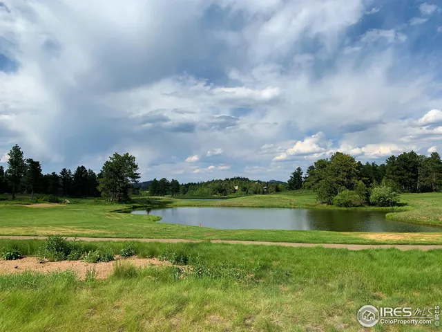 a view of a golf course with a lake
