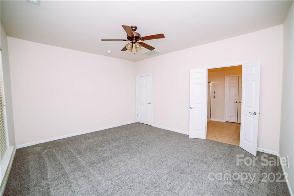 9005 Smokey Hill Road Indian Land, SC 29707 - Photo 13 of 30 a view of a big room with closet and chandelier fan