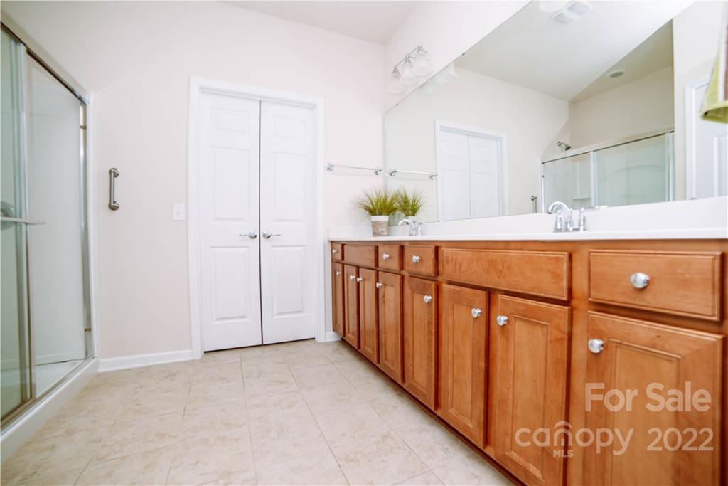 9005 Smokey Hill Road Indian Land, SC 29707 - Photo 17 of 30 a room with a refrigerator and a sink