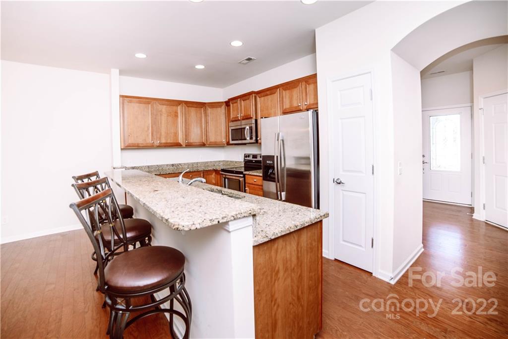 9005 Smokey Hill Road Indian Land, SC 29707 - Photo 4 of 30 a view of a kitchen and dining table