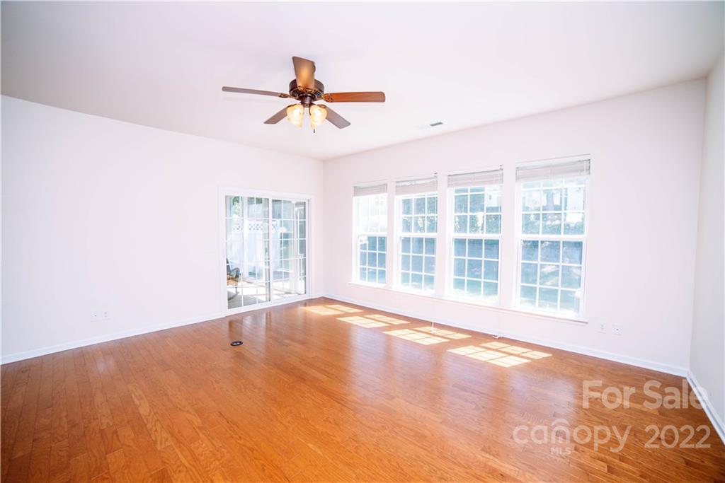9005 Smokey Hill Road Indian Land, SC 29707 - Photo 10 of 30 a view of an empty room with a window and wooden floor