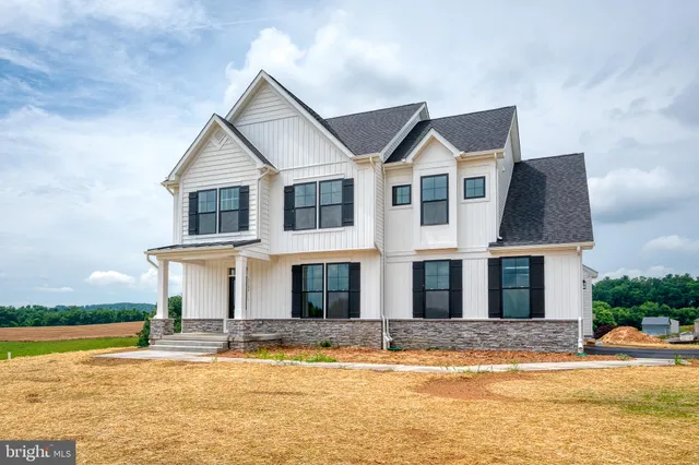 a front view of a house with swimming pool