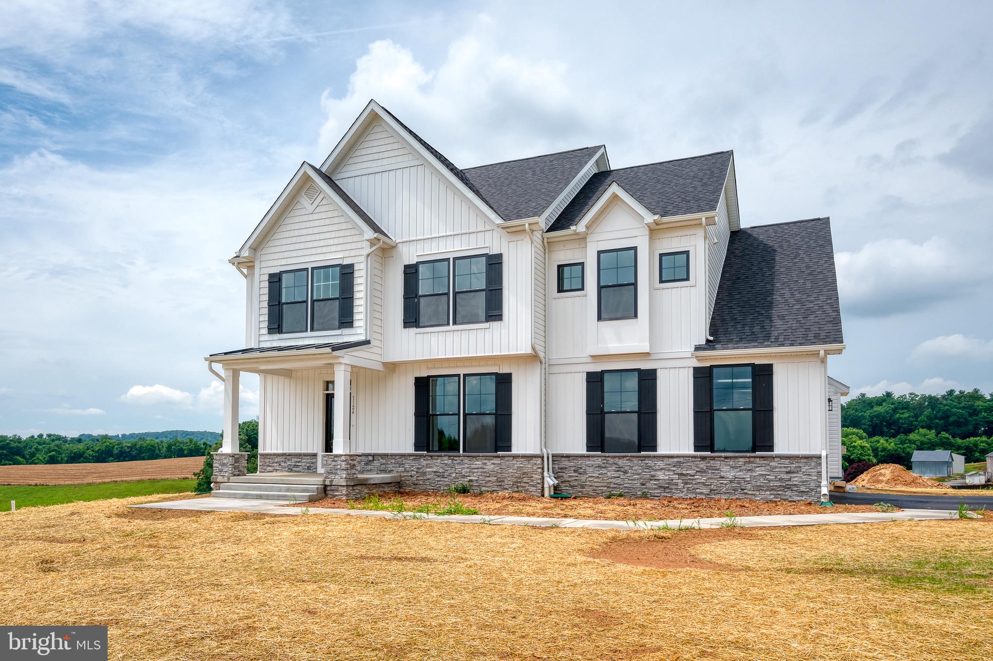 a front view of a house with swimming pool