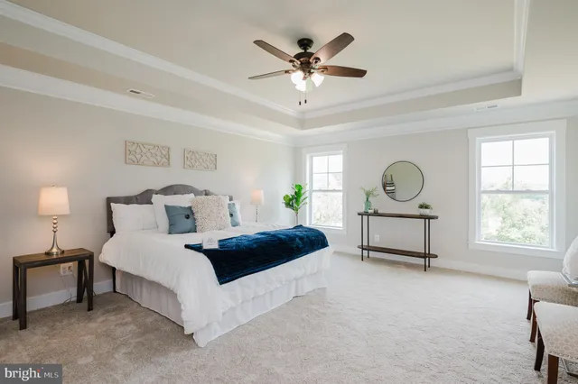 a bed room with a bed and a chandelier