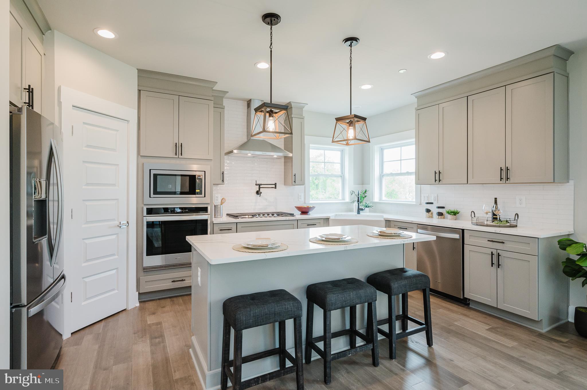 2647 Hoopes Road Forest Hill, MD 21050 - Photo 5 of 29 a kitchen with stainless steel appliances granite countertop a sink a stove a refrigerator and island with wooden floor