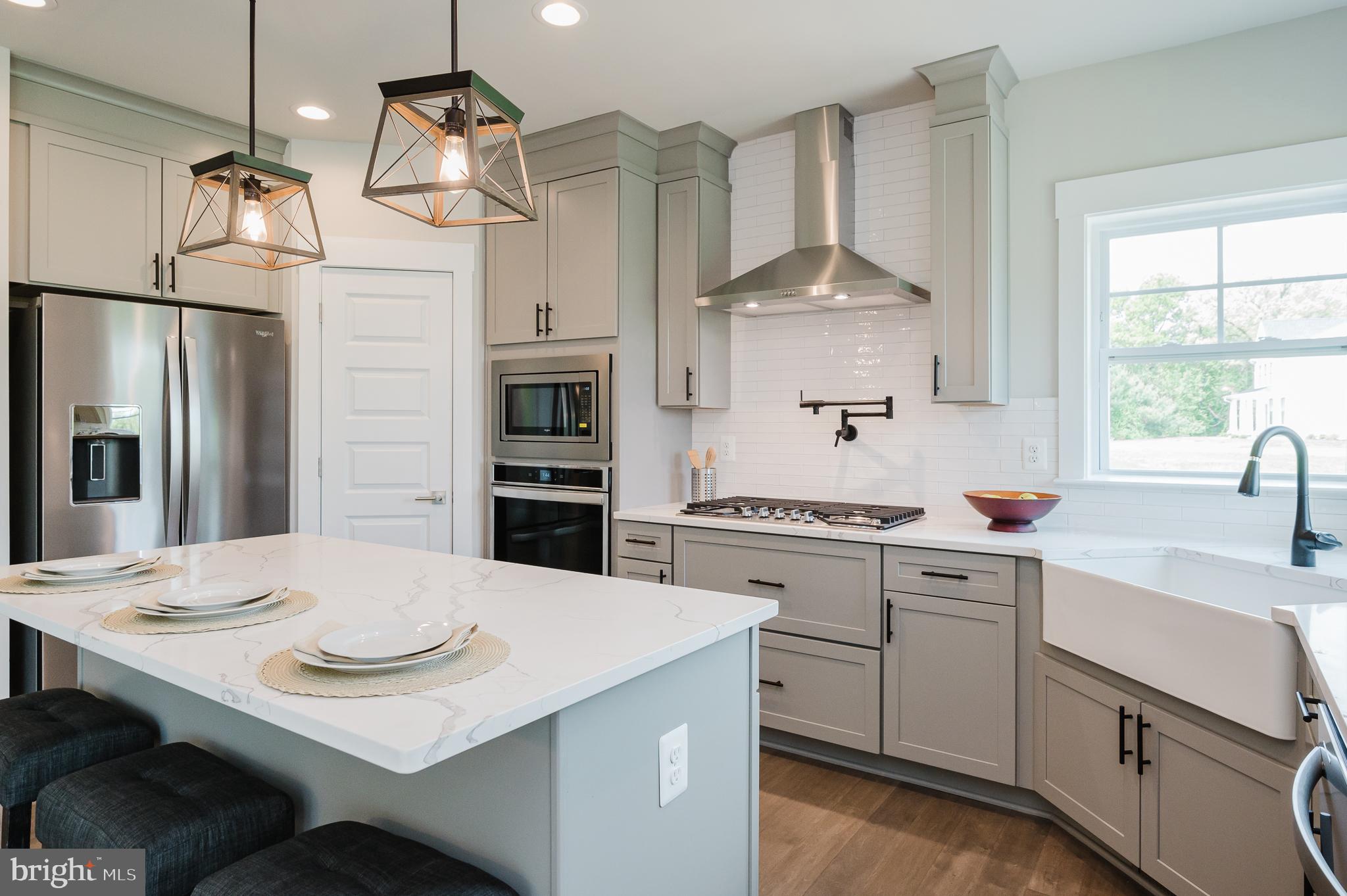 2647 Hoopes Road Forest Hill, MD 21050 - Photo 6 of 29 a kitchen with a sink a stove and refrigerator