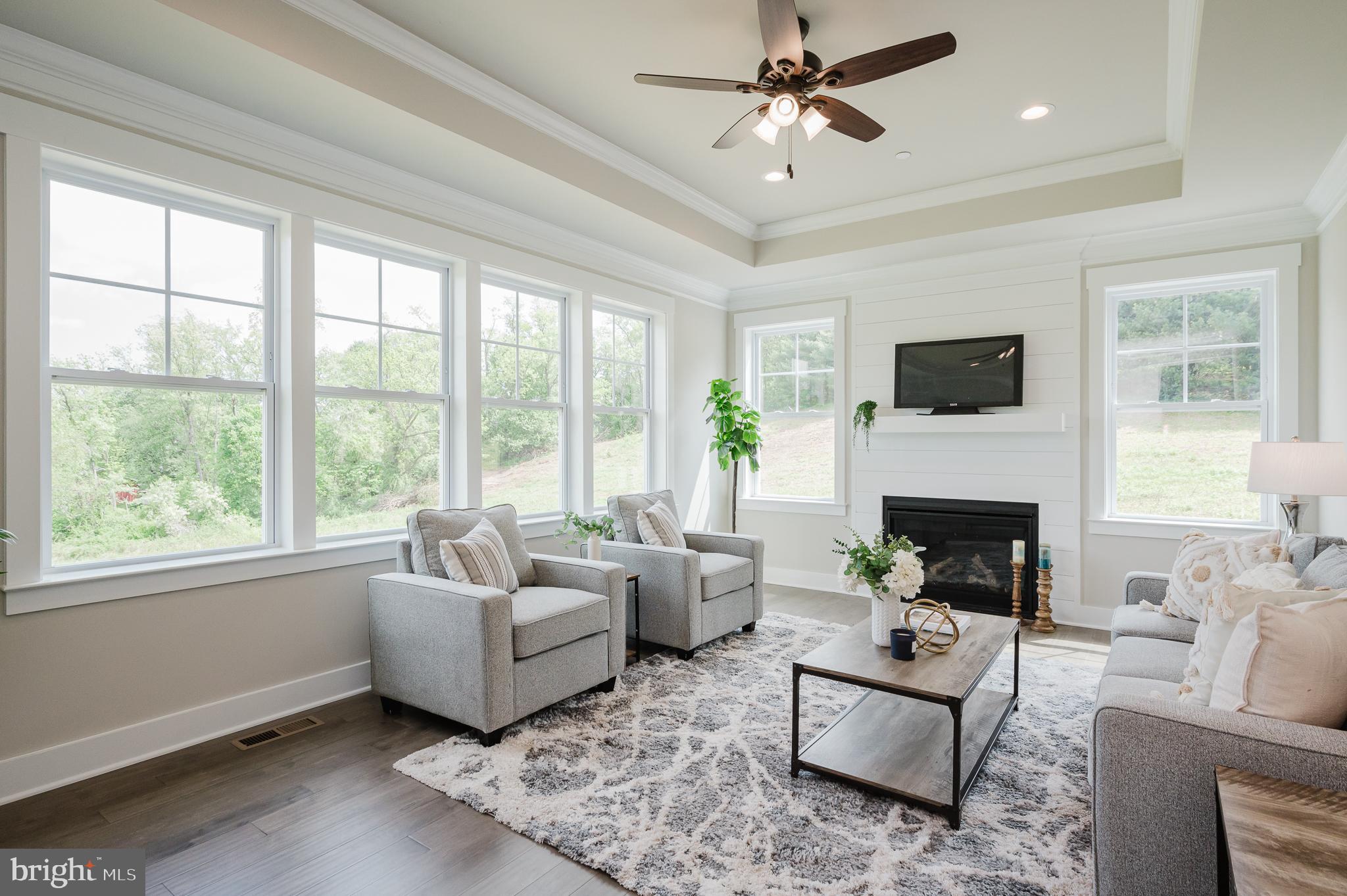 2647 Hoopes Road Forest Hill, MD 21050 - Photo 10 of 29 a living room with furniture a fireplace and a large window