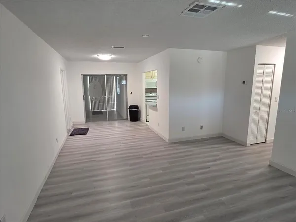 a view of a livingroom with wooden floor