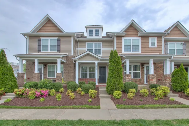 a front view of a house with yard