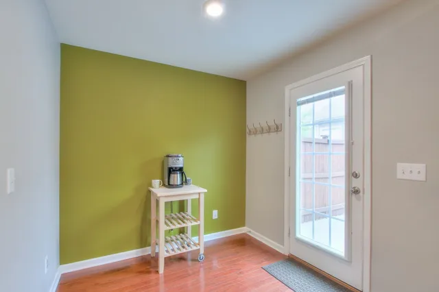 a room with a wooden floor and a table