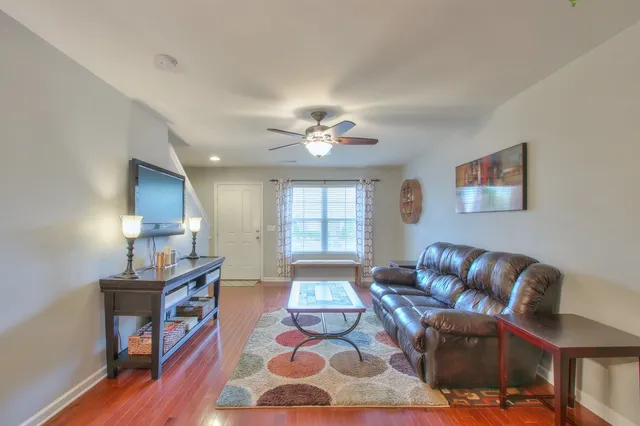 a living room with furniture and a window