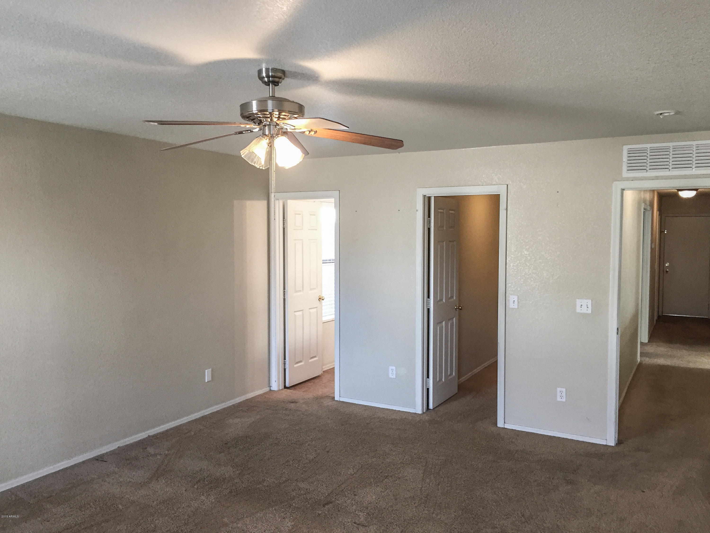 3338 South Conestoga Road Apache Junction, AZ 85119 - Photo 7 of 10 a view of a room with a ceiling fan and a chandelier fan