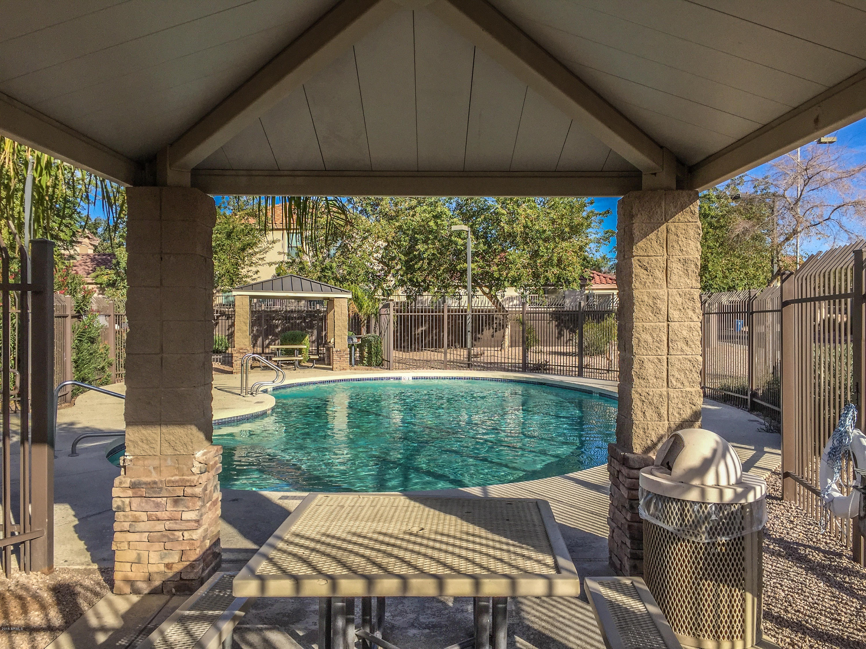 3338 South Conestoga Road Apache Junction, AZ 85119 - Photo 9 of 10 a view of a patio with table and chairs under an umbrella