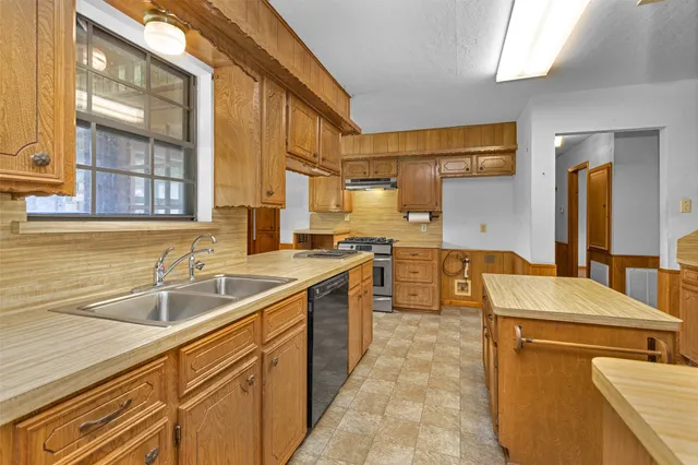 a kitchen with a sink and cabinets
