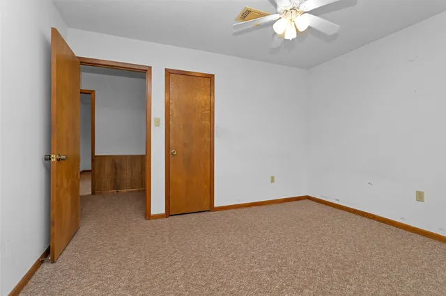 an empty room with a bathroom