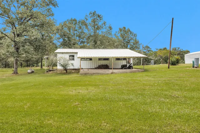 a view of a house with a big yard