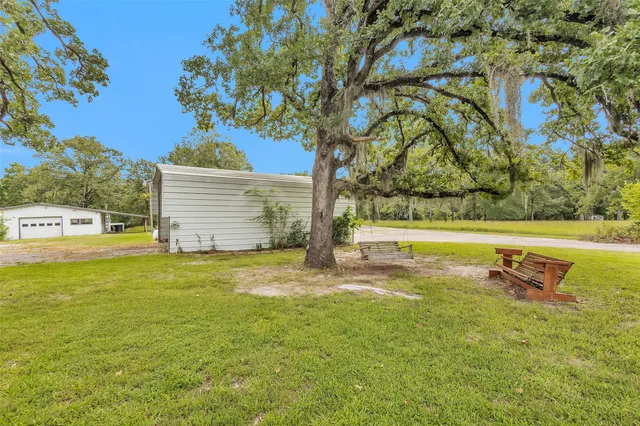 a view of a swimming pool with an outdoor space and seating area