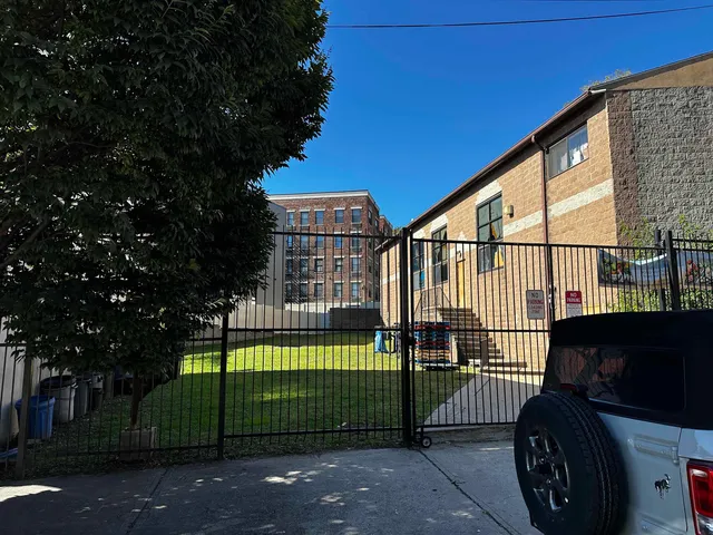 a view of a wrought iron fences in front of house
