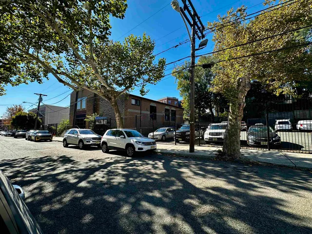 a view of street with parked cars