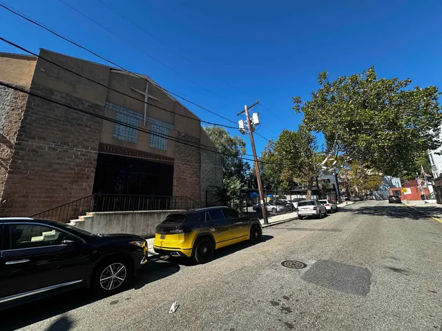 a view of a street with cars