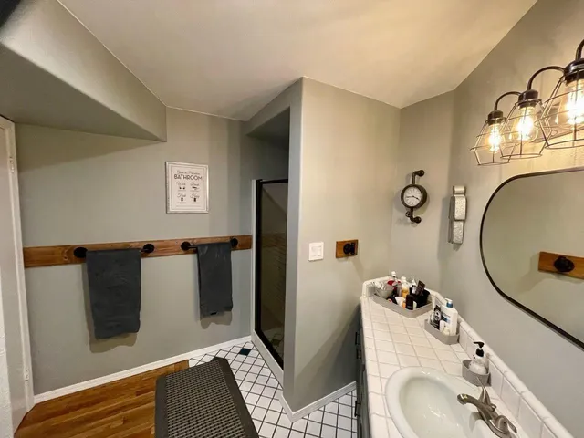 a bathroom with a sink and mirror