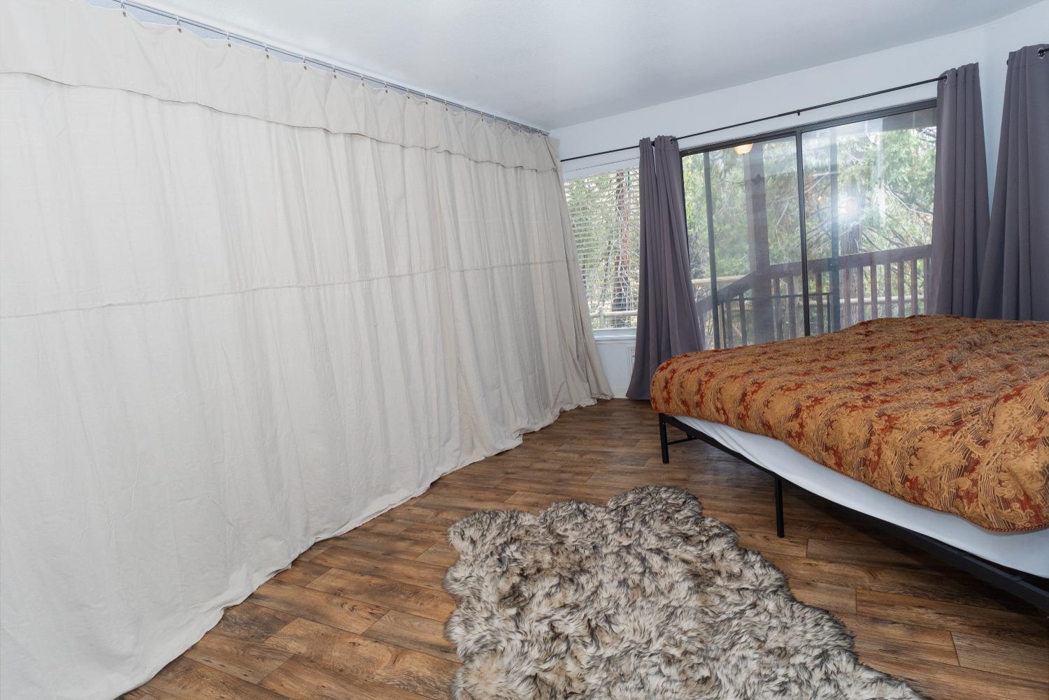 33952 Tocaloma Road Auberry, CA 93602 - Photo 23 of 39 a bedroom with a bed and a window