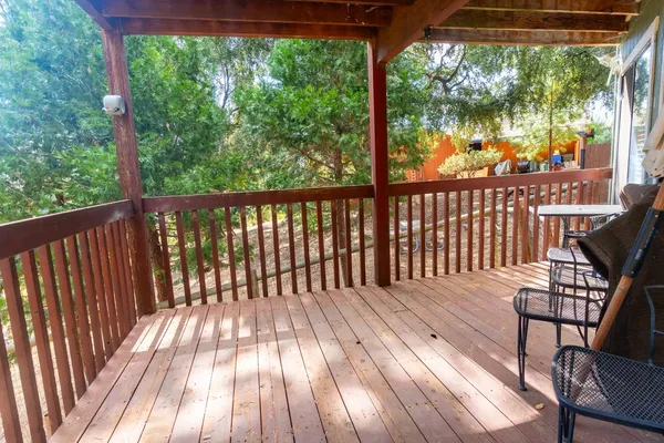 a view of balcony with wooden floor