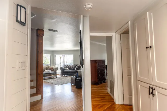 a view of a livingroom with furniture hardwood floor and a livingroom