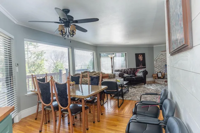 a view of a dining room with furniture window and wooden floor