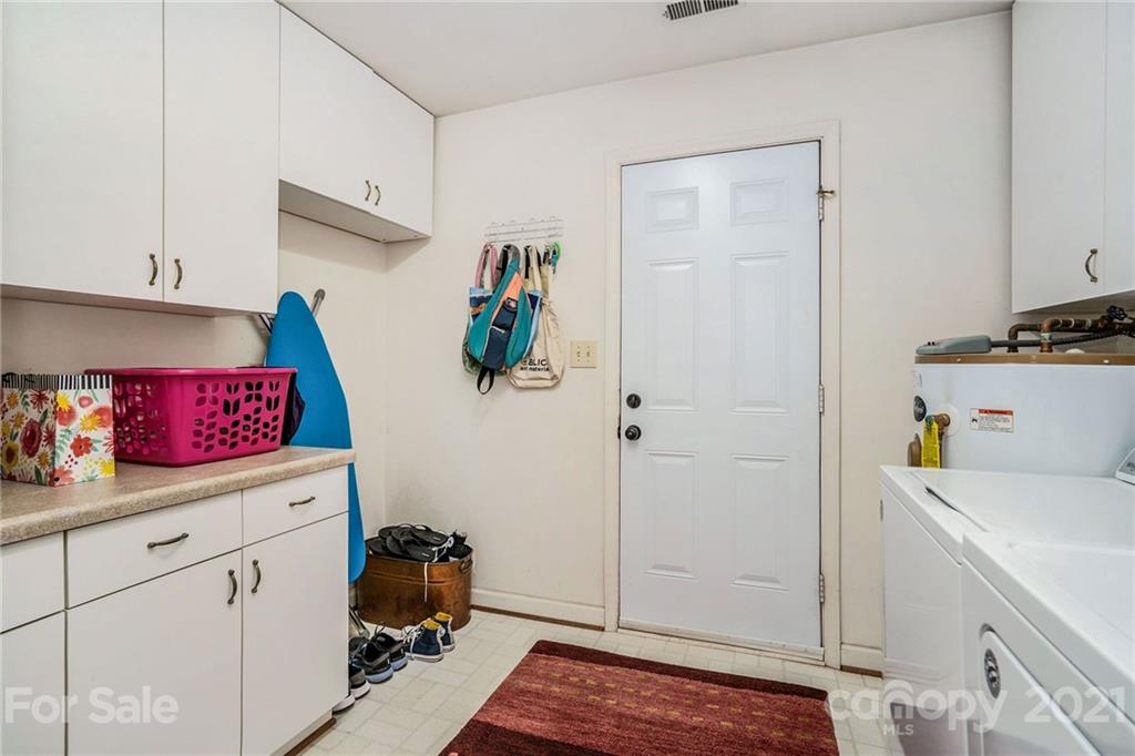 613 Neill Ridge Road Matthews, NC 28105 - Photo 11 of 25 a utility room with sink dryer and washer