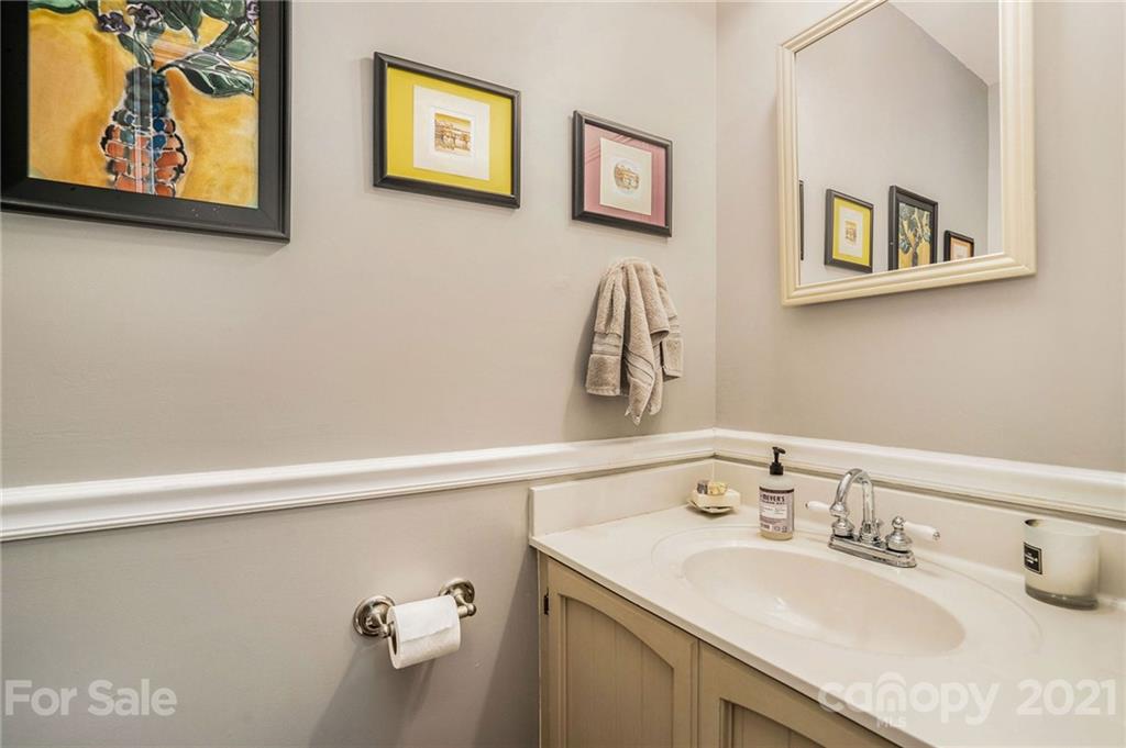 613 Neill Ridge Road Matthews, NC 28105 - Photo 12 of 25 a bathroom with a sink and a mirror