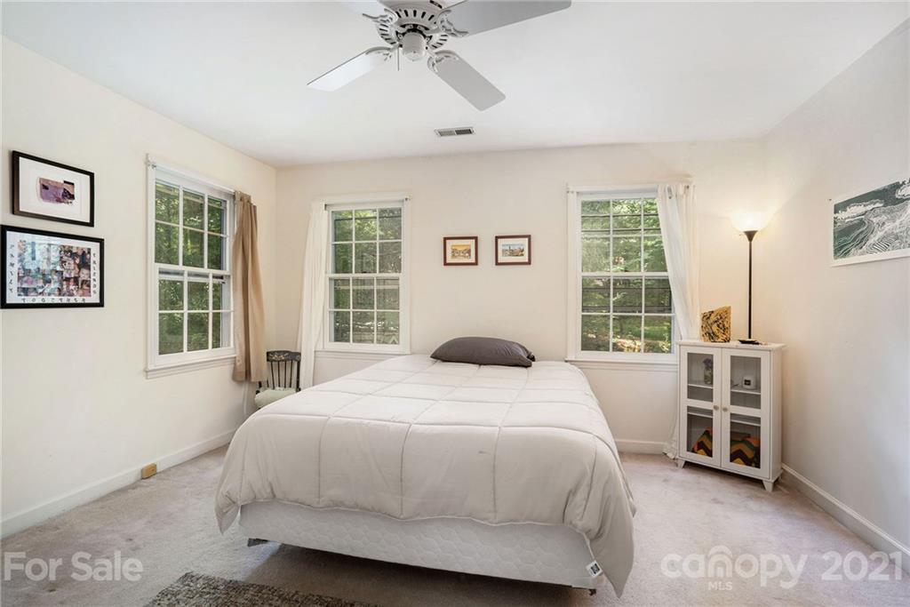 613 Neill Ridge Road Matthews, NC 28105 - Photo 13 of 25 a bedroom with a bed dresser and a window
