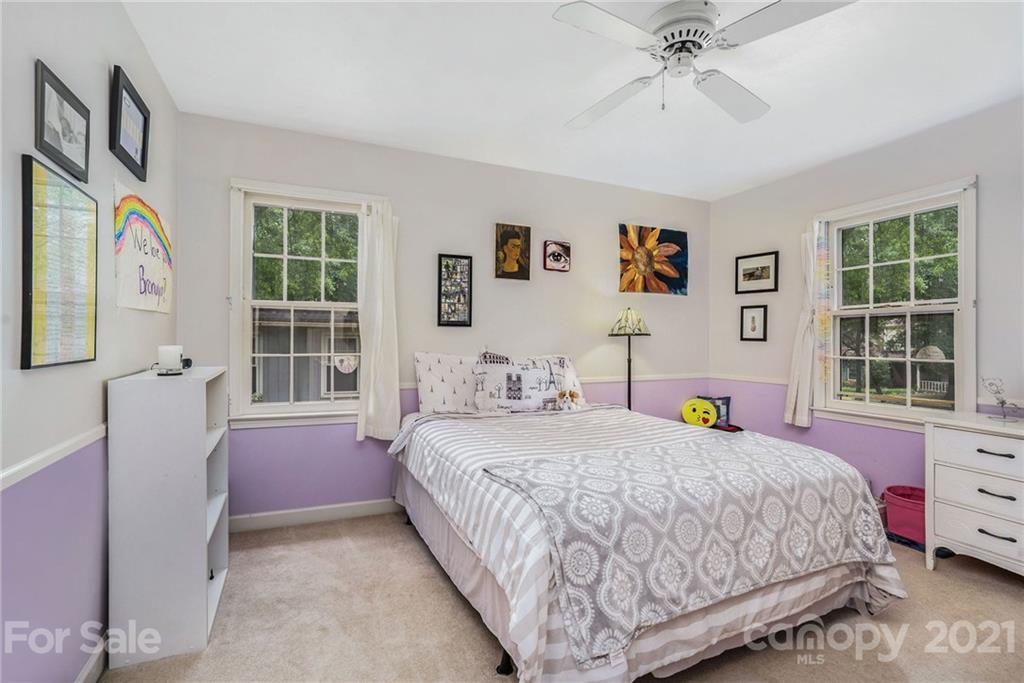 613 Neill Ridge Road Matthews, NC 28105 - Photo 18 of 25 a bedroom with a bed and a window