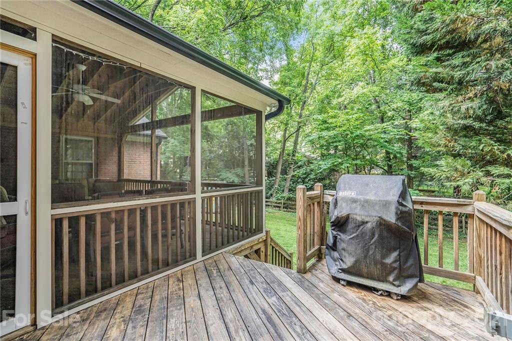 613 Neill Ridge Road Matthews, NC 28105 - Photo 21 of 25 a view of backyard with deck and outdoor seating