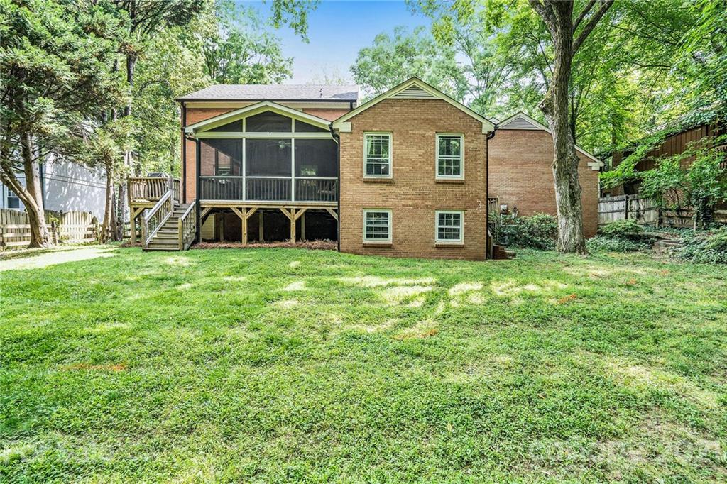 613 Neill Ridge Road Matthews, NC 28105 - Photo 22 of 25 a view of a house with a yard