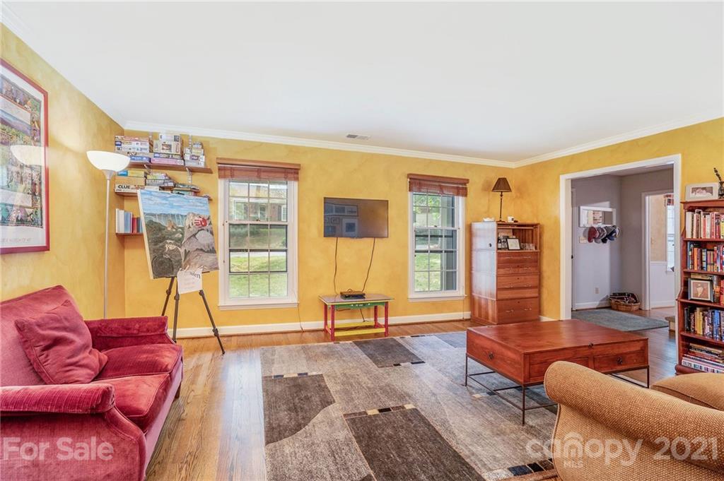 613 Neill Ridge Road Matthews, NC 28105 - Photo 5 of 25 a living room with furniture and large windows