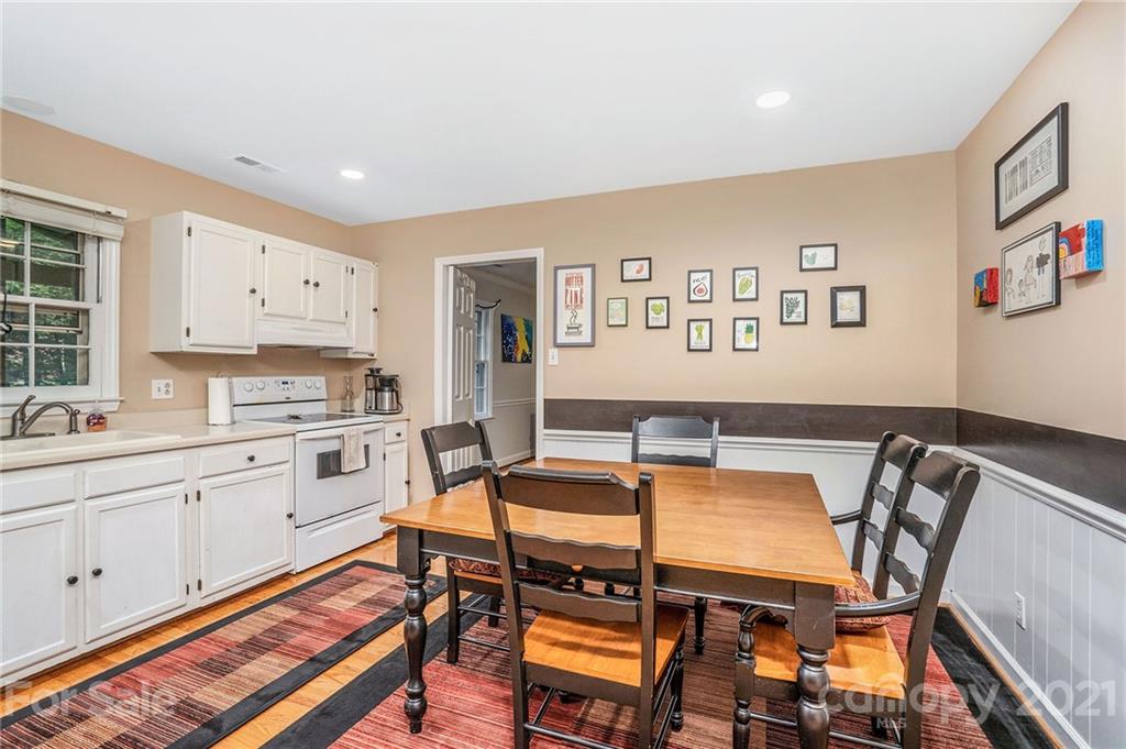 613 Neill Ridge Road Matthews, NC 28105 - Photo 10 of 25 a view of a dining room with furniture and a kitchen