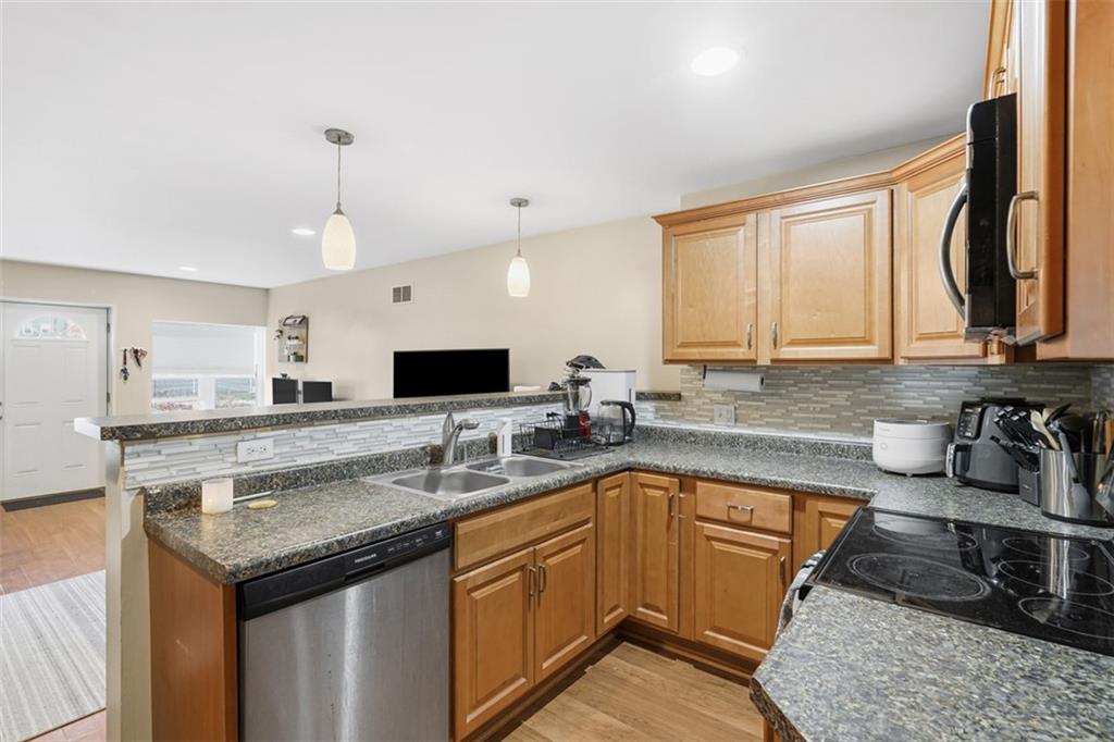 1202 Sarah Street Pittsburgh, PA 15203 - Photo 11 of 37 a kitchen with a sink stove and cabinets